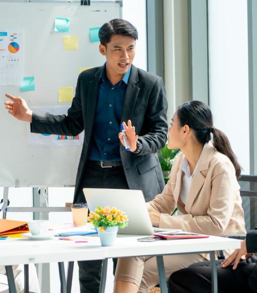 asian business man present the project on whiteboard
